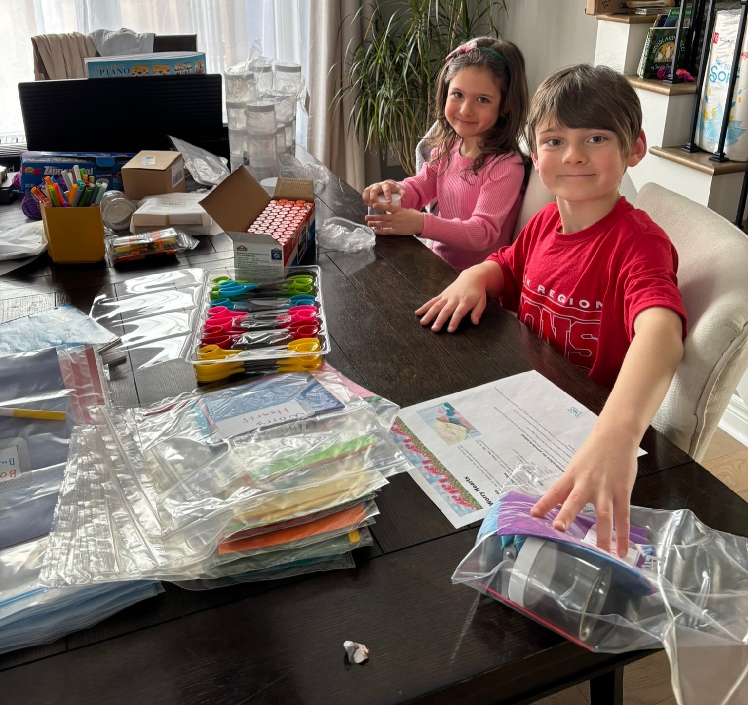 Children crafting together with colourful supplies